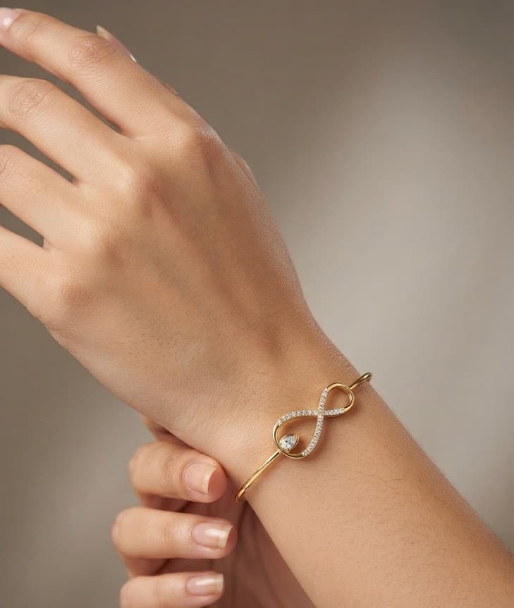 The Infinite Pear Drop Diamond and Gold Bangle — image 1
